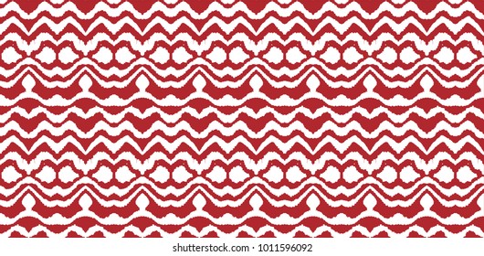 Ikat seamless pattern. Vector tie dye  shibori print with stripes and chevron. Ink textured japanese background.  Ethnic fabric vector. Bohemian fashion. Endless watercolor texture. African rug.