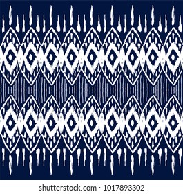 Ikat seamless pattern. Vector tie dye  shibori print with stripes and chevron. Ink textured japanese background.  Ethnic fabric vector. Bohemian fashion. Endless watercolor texture. African rug.