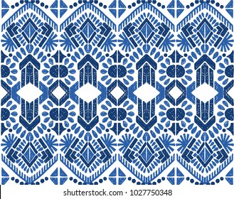 Ikat seamless pattern. Vector tie dye  shibori print with stripes and chevron. Ink textured japanese background.  Ethnic fabric vector. Bohemian fashion. Endless watercolor texture. African rug.