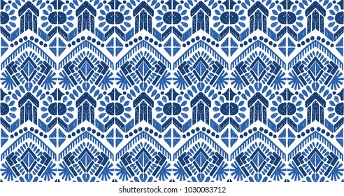 Ikat seamless pattern. Vector tie dye  shibori print with stripes and chevron. Ink textured japanese background.  Ethnic fabric vector. Bohemian fashion. Endless watercolor texture. African rug.