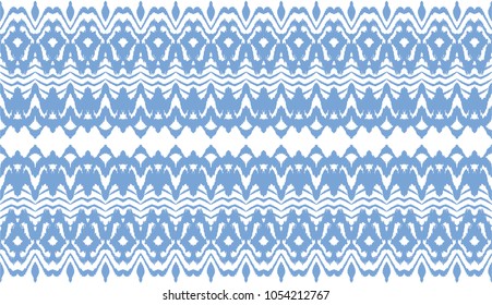 Ikat seamless pattern. Vector tie dye  shibori print with stripes and chevron. Ink textured japanese background.  Ethnic fabric vector. Bohemian fashion. 