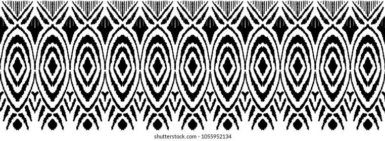 Ikat seamless pattern. Vector tie dye shibori print with stripes and chevron.