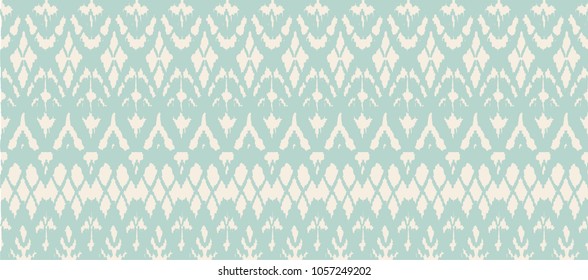 Ikat seamless pattern. Vector tie dye shibori print with stripes and chevron. Ink textured japanese background. Ethnic fabric vector. Bohemian fashion. Endless watercolor texture. African rug.
