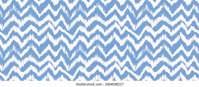 Ikat seamless pattern. Vector tie dye shibori print with stripes and chevron. Ink textured japanese background. Ethnic fabric vector. Bohemian fashion. Endless watercolor texture. African rug.