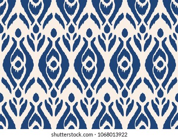 Ikat seamless pattern. Vector tie dye shibori print with stripes and chevron. Ink textured japanese background. Ethnic fabric vector. Bohemian fashion. Endless watercolor texture. African rug.