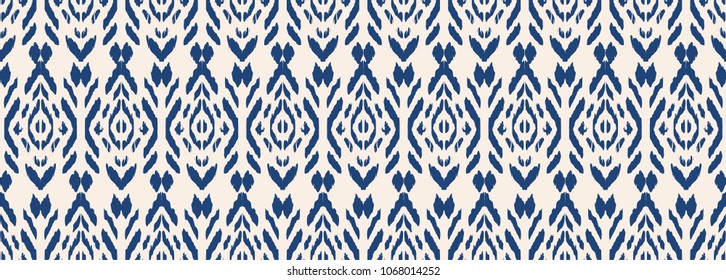 Ikat seamless pattern. Vector tie dye shibori print with stripes and chevron. Ink textured japanese background. Ethnic fabric vector. Bohemian fashion. Endless watercolor texture. African rug.