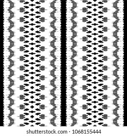 Ikat seamless pattern. Vector tie dye shibori print with stripes and chevron. Ink textured japanese background. Ethnic fabric vector. Bohemian fashion. Endless watercolor texture. African rug.