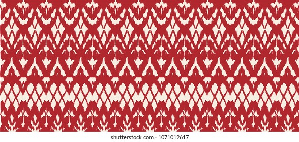 Ikat seamless pattern. Vector tie dye shibori print with stripes and chevron. Ink textured japanese background. Ethnic fabric vector. Bohemian fashion. Endless watercolor texture. African rug.
