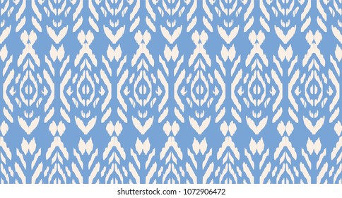 Ikat seamless pattern. Vector tie dye shibori print with stripes and chevron. Ink textured japanese background. Ethnic fabric vector. Bohemian fashion. Endless watercolor texture. African rug.