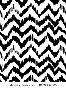 Ikat seamless pattern. Vector tie dye shibori print with stripes and chevron. Ink textured japanese background. Ethnic fabric vector. Bohemian fashion. Endless watercolor texture. African rug.