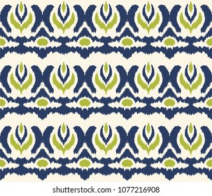 Ikat seamless pattern. Vector tie dye shibori print with stripes and chevron. Ink textured japanese background. Ethnic fabric vector. Bohemian fashion. Endless watercolor texture. African rug.