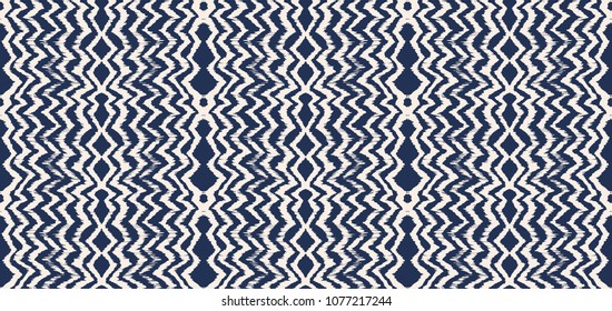 Ikat seamless pattern. Vector tie dye shibori print with stripes and chevron. Ink textured japanese background. Ethnic fabric vector. Bohemian fashion. Endless watercolor texture. African rug.