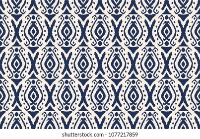 Ikat seamless pattern. Vector tie dye shibori print with stripes and chevron. Ink textured japanese background. Ethnic fabric vector. Bohemian fashion. Endless watercolor texture. African rug.