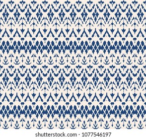 Ikat seamless pattern. Vector tie dye shibori print with stripes and chevron. Ink textured japanese background. Ethnic fabric vector. Bohemian fashion. Endless watercolor texture. African rug.