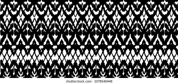 	
Ikat seamless pattern. Vector tie dye shibori print with stripes and chevron. Ink textured japanese background. Ethnic fabric vector. Bohemian fashion. Endless watercolor texture. African rug.