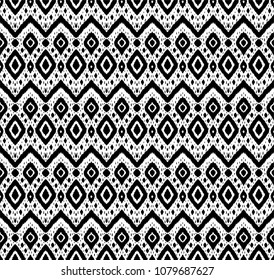 Ikat seamless pattern. Vector tie dye shibori print with stripes and chevron. Ink textured japanese background. Ethnic fabric vector. Bohemian fashion. Endless watercolor texture. African rug.