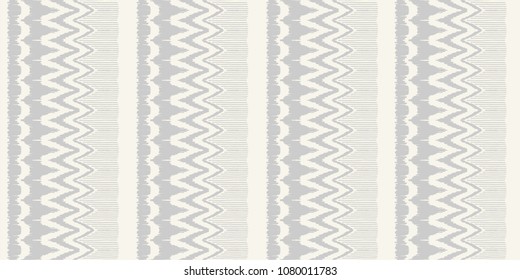 Ikat seamless pattern. Vector tie dye shibori print with stripes and chevron. Ink textured japanese background. Ethnic fabric vector. Bohemian fashion. Endless watercolor texture. African rug.
