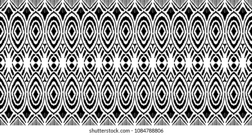 Ikat seamless pattern. Vector tie dye shibori print with stripes and chevron. Ink textured japanese background. Ethnic fabric vector. Bohemian fashion. Endless watercolor texture. African rug.