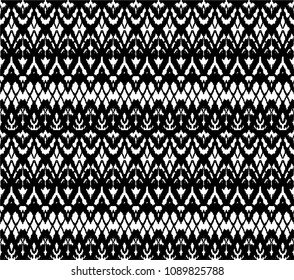 Ikat seamless pattern. Vector tie dye shibori print with stripes and chevron. Ink textured japanese background. Ethnic fabric vector. Bohemian fashion. Endless watercolor texture. African rug.