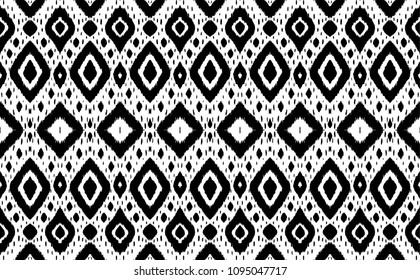 Ikat seamless pattern. Vector tie dye shibori print with stripes and chevron. Ink textured japanese background. Ethnic fabric vector. Bohemian fashion. Endless watercolor texture. African rug.