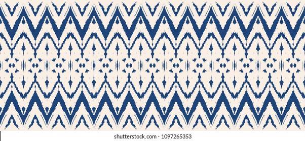 Ikat seamless pattern. Vector tie dye shibori print with stripes and chevron. Ink textured japanese background. Ethnic fabric vector. Bohemian fashion. Endless watercolor texture. African rug.