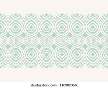 Ikat seamless pattern. Vector tie dye shibori print with stripes and chevron. Ink textured japanese background. Ethnic fabric vector. Bohemian fashion. Endless watercolor texture. African rug.