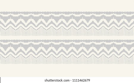 Ikat seamless pattern. Vector tie dye shibori print with stripes and chevron. Ink textured japanese background. Ethnic fabric vector. Bohemian fashion. Endless watercolor texture. African rug.