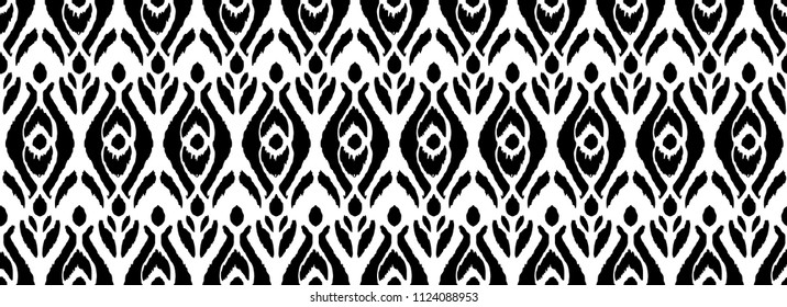 Ikat seamless pattern. Vector tie dye shibori print with stripes and chevron. Ink textured japanese background. Ethnic fabric vector. Bohemian fashion. Endless watercolor texture. African rug.