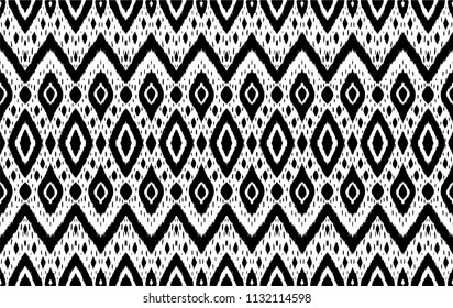 Ikat seamless pattern. Vector tie dye shibori print with stripes and chevron. Ink textured japanese background. Ethnic fabric vector. Bohemian fashion. Endless watercolor texture. African rug.