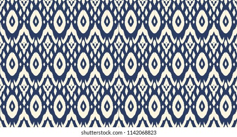 Ikat seamless pattern. Vector tie dye shibori print with stripes and chevron. Ink textured japanese background. Ethnic fabric vector. Bohemian fashion. Endless watercolor texture. African rug.
