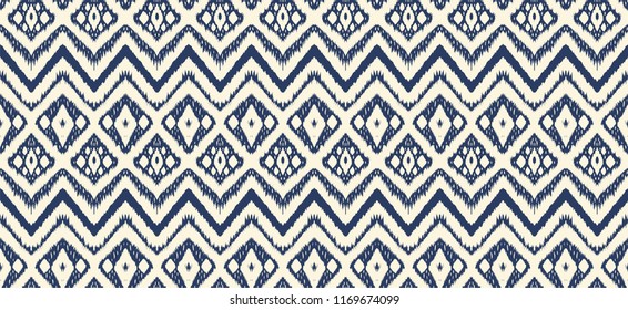 Ikat seamless pattern. Vector tie dye shibori print with stripes and chevron. Ink textured japanese background. Ethnic fabric vector. Bohemian fashion. Endless watercolor texture. African rug.