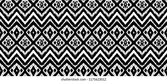 Ikat seamless pattern. Vector tie dye shibori print with stripes and chevron. Ink textured japanese background. Ethnic fabric vector. Bohemian fashion. Endless watercolor texture. African rug.