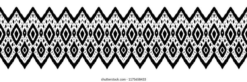 Ikat seamless pattern. Vector tie dye shibori print with stripes and chevron. Ink textured japanese background. Ethnic fabric vector. Bohemian fashion. Endless watercolor texture. African rug.