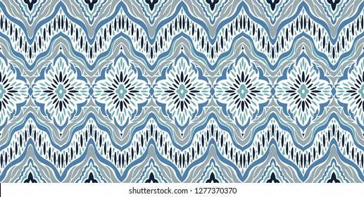 Ikat seamless pattern. Vector tie dye shibori print. Ink textured japanese background. Ethnic fabric vector. Bohemian fashion. Endless watercolor texture. African rug.