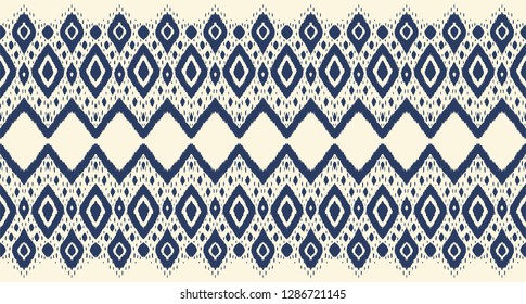Ikat seamless pattern. Vector tie dye shibori print with stripes and chevron. Ink textured japanese background. Ethnic fabric vector. Bohemian fashion. Endless watercolor texture. African rug