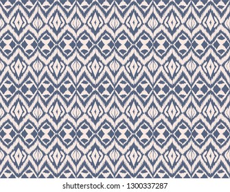 Ikat seamless pattern. Vector tie dye shibori print with stripes and chevron. Ink textured japanese background. Ethnic fabric vector. Bohemian fashion. Endless watercolor texture. African rug.