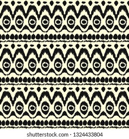 Ikat seamless pattern. Vector tie dye shibori print with stripes and chevron. Ink textured japanese background. Ethnic fabric vector. Bohemian fashion. Endless watercolor texture. African rug.