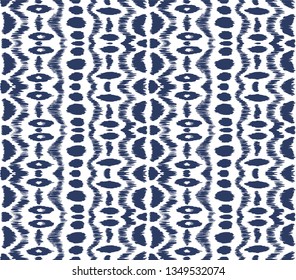 Ikat seamless pattern. Vector tie dye shibori print with stripes and chevron. Ink textured japanese background. Ethnic fabric vector. Bohemian fashion. Endless watercolor texture. African rug.