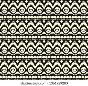 Ikat seamless pattern. Vector tie dye shibori print with stripes and chevron. Ink textured japanese background. Ethnic fabric vector. Bohemian fashion. Endless watercolor texture. African rug.