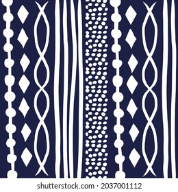 Ikat seamless pattern. Vector tie dye shibori print with stripes and chevron. Ink textured japanese background. Ethnic fabric vector. Bohemian fashion. Endless watercolor texture. 