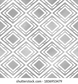 Ikat silver seamless pattern. Geometric boho pattern. Traditional background. Elegant ethnic texture. Navajo motif. Abstract Ikat backdrop. Silver foil for design folk wallpapers, prints. Vector 