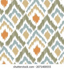 Ikat tye die boho vintage pattern seamless repeat vintage decor textile design organic hand made batik modern and trendy boho print orange blue green brown