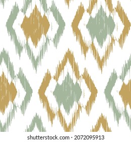 Ikat tye die boho vintage pattern seamless repeat vintage decor textile design organic hand made batik modern and trendy boho print green brown yellow