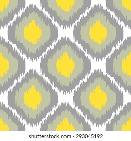 Ikat vector seamless pattern. Abstract geometric background for fabric, print or wrapping paper. Grey and yellow color