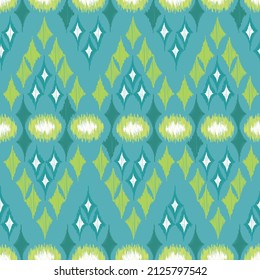 Ikat.Seamless pattern of geometric in green,blue,white background.Image for carpet,quilt,shawl.Abstract.Embroidery ethnic tribal.Vector.Illustration.
