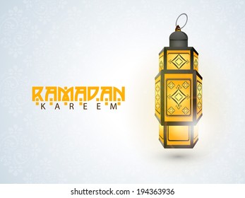 Illuminated arabic lantern on blue background for holy month of muslim community Ramadan Kareem.