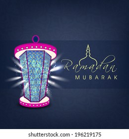 Illuminated colorful arabic lantern on blue background for holy month of Muslim community Ramadan Kareem. 
