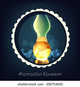 Illuminated floral decorated lantern on shiny blue background for holy month of Muslim community Ramadan Kareem. 