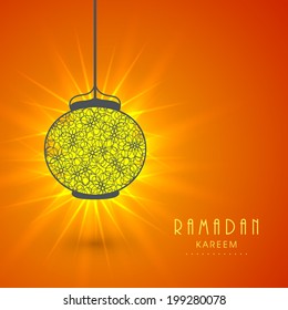 Illuminated hanging lantern on shiny orange background for holy month of Muslim community Ramadan Kareem. 