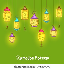 Illuminated hanging lanterns on green background for holy month of Muslim community Ramadan Kareem on green background. 